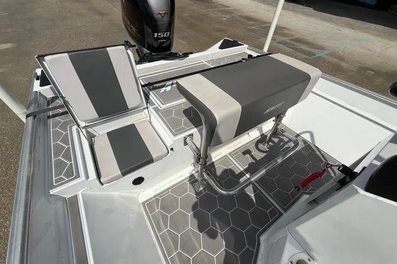 Slide: The Image of 2024 Alweld 2070cc boat interior with seating and Yamaha 150 engine. - 10