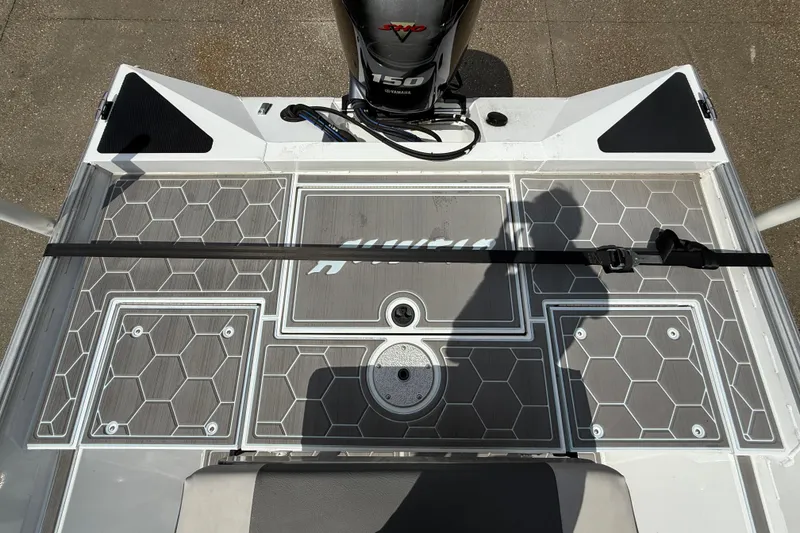 Slide: The Image of 2024 Alweld 2070cc boat deck with Yamaha 150 engine, featuring hexagonal pattern flooring. - 11