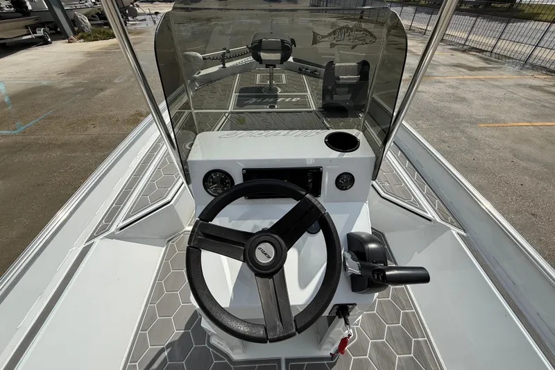 Slide: The Image of 2024 Alweld 2070cc boat console with steering wheel and controls, featuring hexagonal flooring. - 12