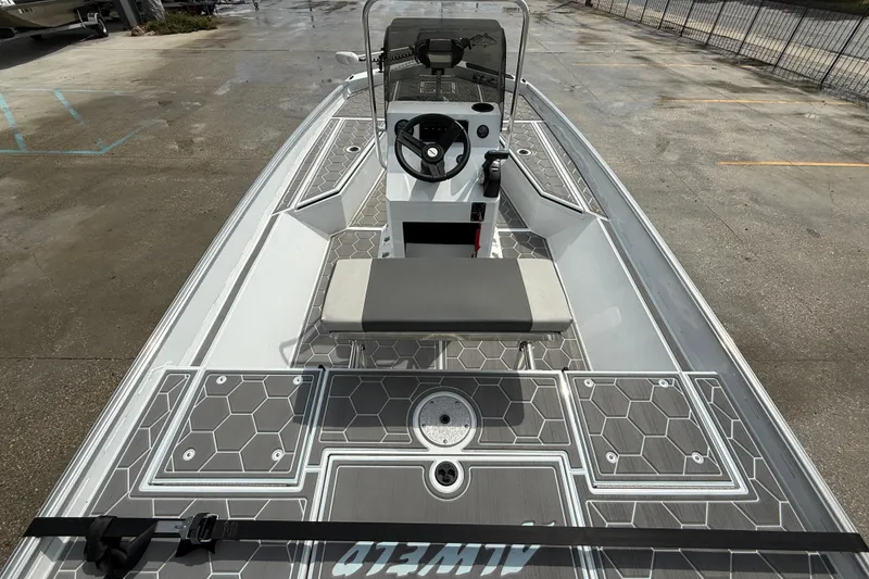 Slide: The Image of 2024 Alweld 2070cc boat with modern console and hexagonal deck pattern. - 7