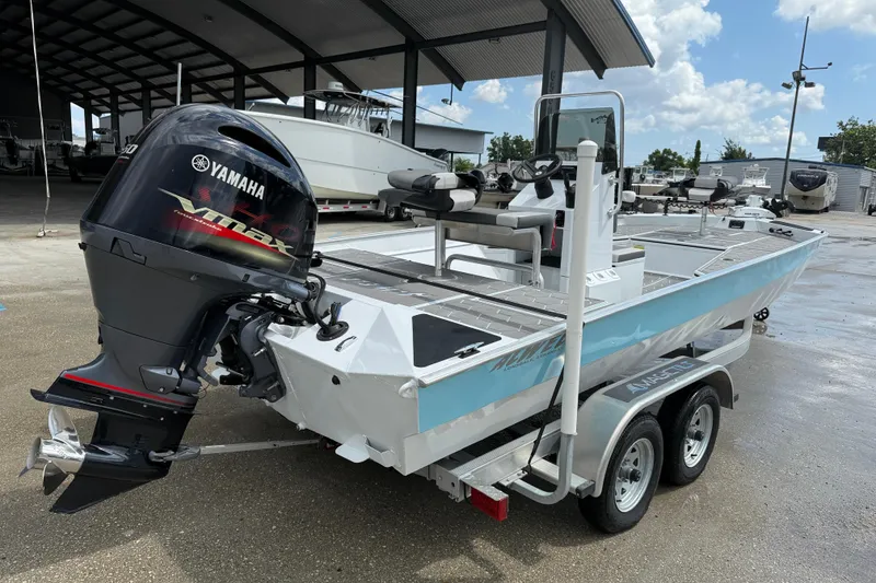 Slide: The Image of 2024 Alweld 2070cc boat with Yamaha VMAX engine on a trailer. - 6