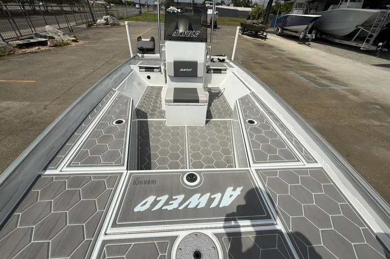 Slide: The Image of 2024 Alweld 2070cc boat with hexagonal deck pattern and central console. - 9