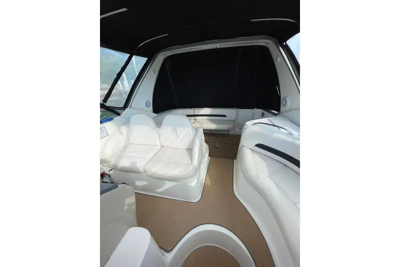 Slide: The Image of Interior of 2000 Chaparral Signature 300 boat with white seating and tan flooring. - 15