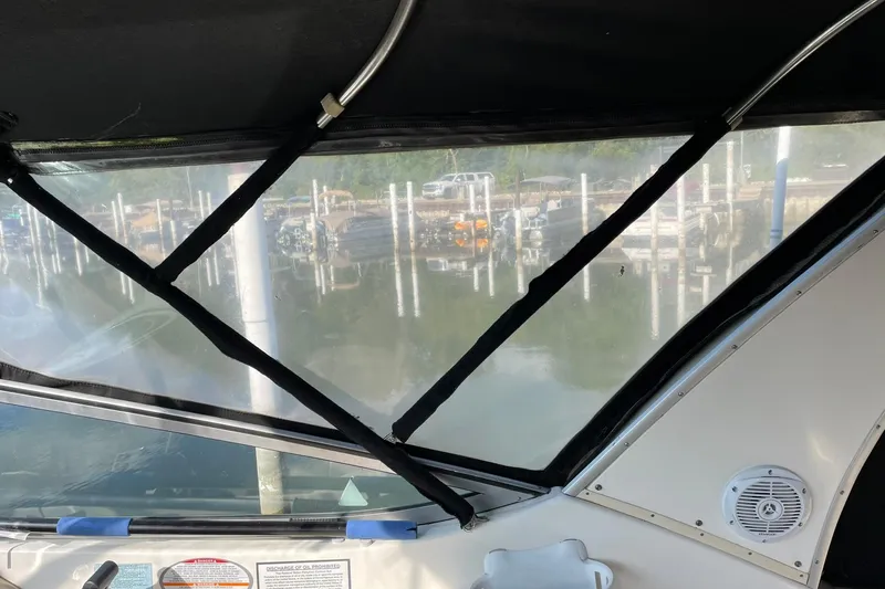 Slide: The Image of Interior view from a 2000 Chaparral Signature 300 boat, overlooking a marina. - 16