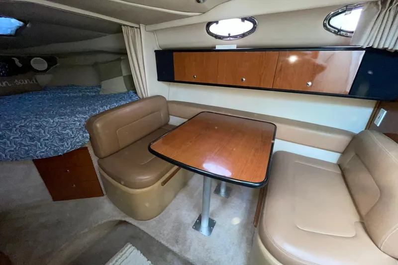 Slide: The Image of 2000 Chaparral Signature 300 cabin interior with seating and table. - 22