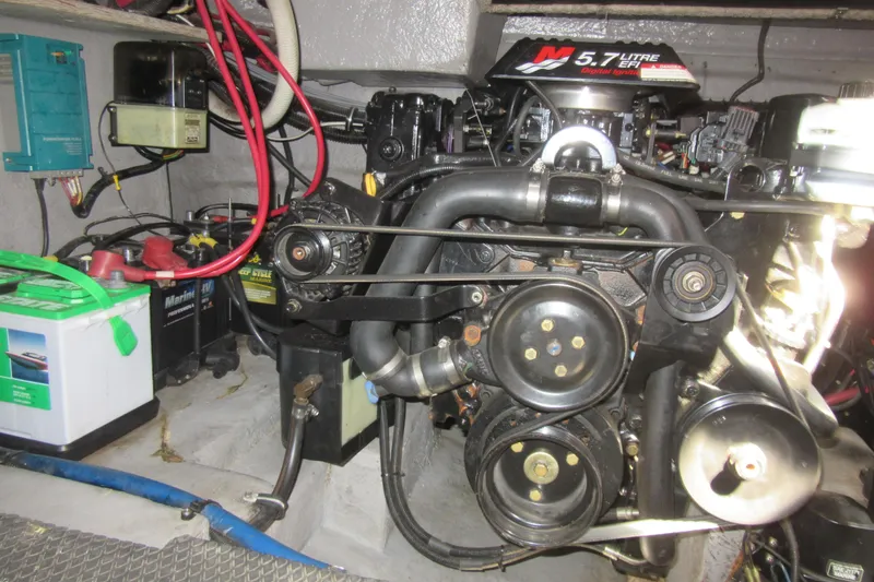 Slide: The Image of Engine compartment of 2000 Chaparral Signature 300 with 5.7L EFI motor and marine batteries. - 28