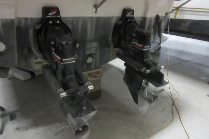Slide: The Image of 2000 Chaparral Signature 300 boat with dual Mercury MerCruiser outdrives in a garage. - 30