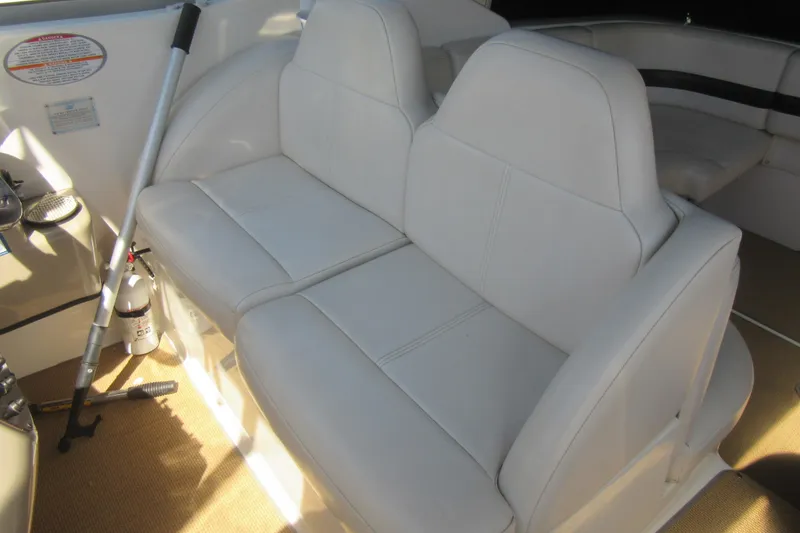 Slide: The Image of Interior seating of 2000 Chaparral Signature 300 boat, featuring white leather upholstery. - 8