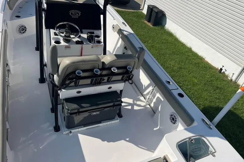 Slide: The Image of 2023 Sportsman Open 242 Center Console boat interior with helm and seating. - 3