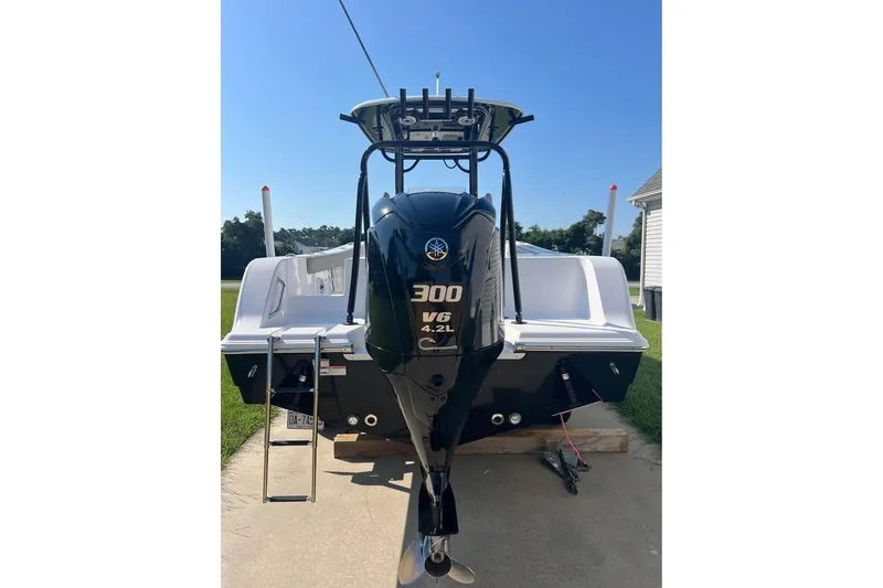 Slide: The Image of 2023 Sportsman Open 242 Center Console boat with powerful 300 V6 engine. - 4