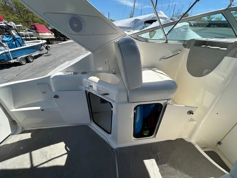 Slide: The Image of 2007 Bayliner 305 boat interior with seating and storage compartments. - 12