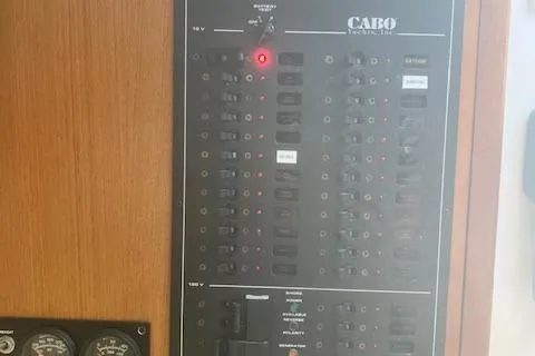 Slide: The Image of Interior of 2001 Cabo 31 Express boat with kitchenette and cozy sleeping area. - 14