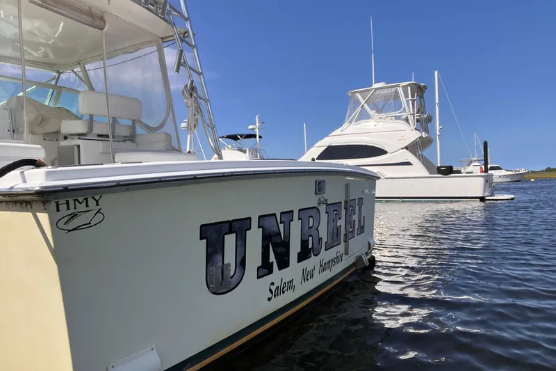 Slide: The Image of 2001 Cabo 31 Express boat cruising swiftly on open water. - 2