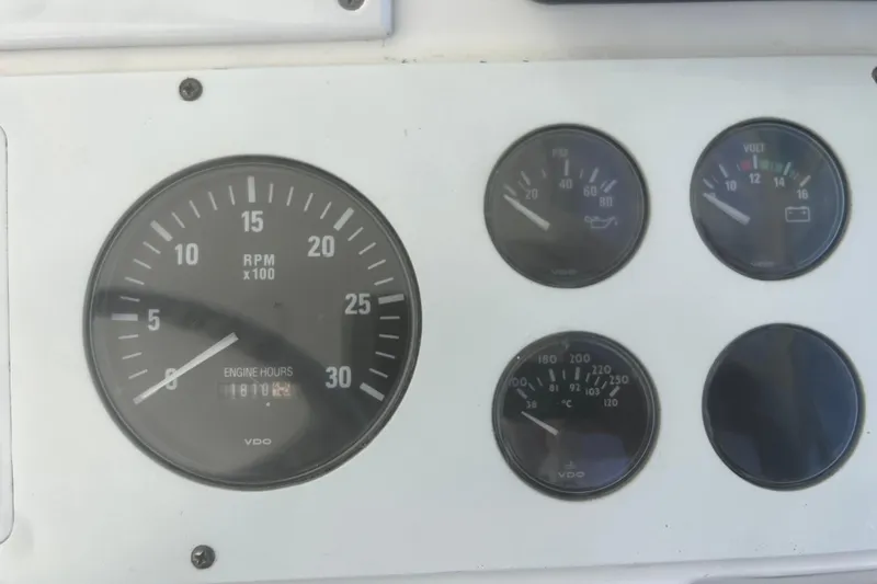 Slide: The Image of Instrument panel of a 2001 Cabo 31 Express boat showing RPM and engine hours. - 22