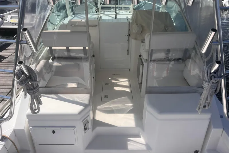 Slide: The Image of 2001 Cabo 31 Express boat cruising on calm waters. - 4