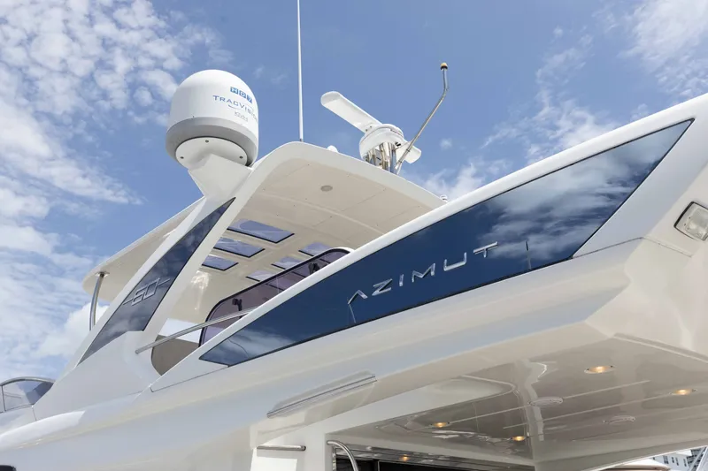 Slide: The Image of 2014 Azimut 60 Flybridge yacht against a clear blue sky. - 2