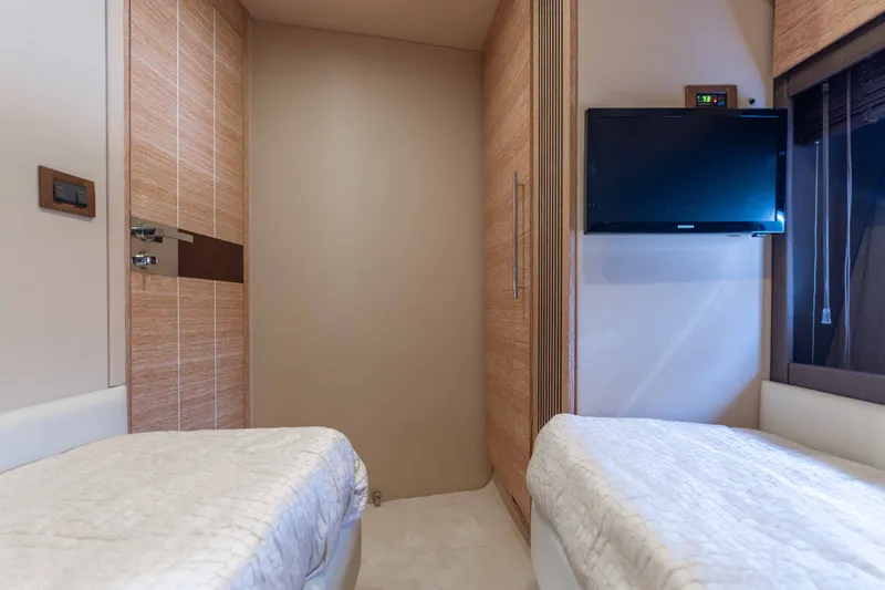 Slide: The Image of Luxurious cabin interior of 2014 Azimut 60 Flybridge yacht with twin beds and wall-mounted TV. - 20