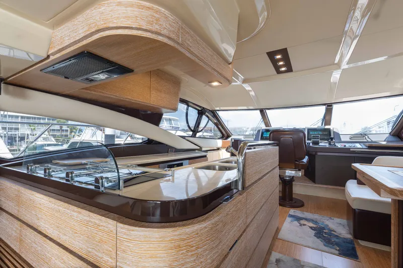 Slide: The Image of Luxurious interior of 2014 Azimut 60 Flybridge yacht with modern kitchen and helm. - 25