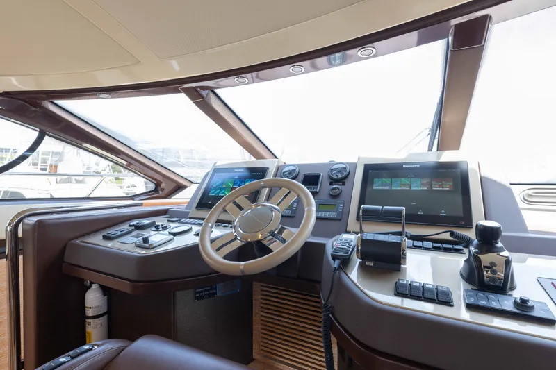 Slide: The Image of Helm of 2014 Azimut 60 Flybridge yacht with modern navigation equipment and controls. - 27