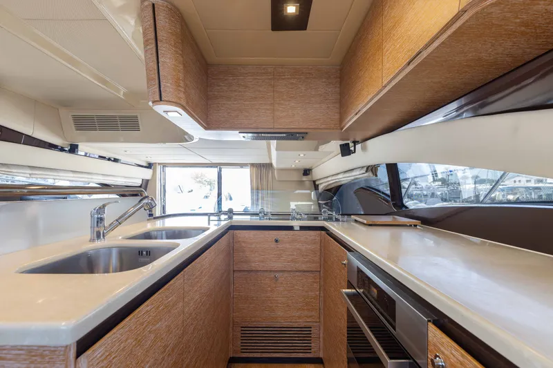 Slide: The Image of Luxurious kitchen interior of 2014 Azimut 60 Flybridge yacht with modern amenities. - 29