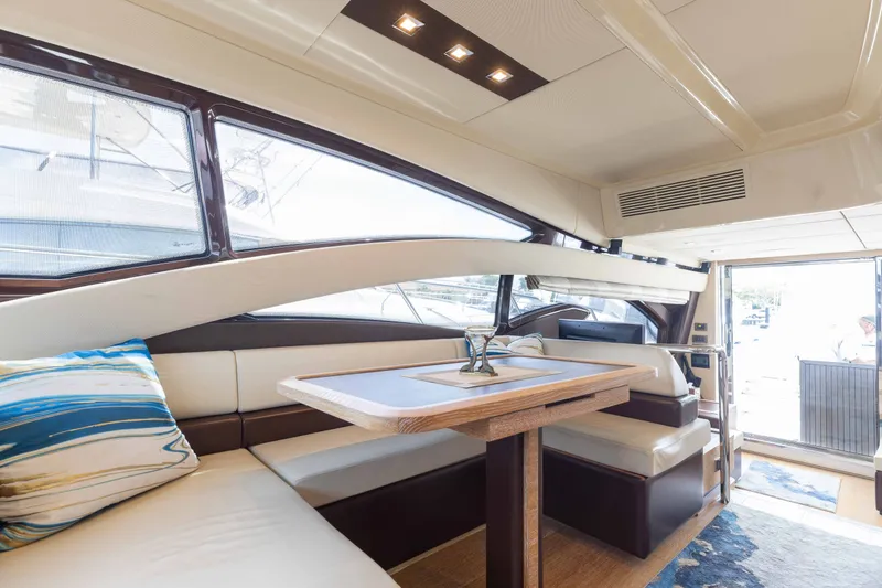 Slide: The Image of Luxurious interior of 2014 Azimut 60 Flybridge yacht with elegant seating and dining area. - 30