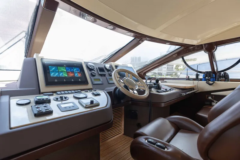 Slide: The Image of Luxurious helm of 2014 Azimut 60 Flybridge yacht with advanced navigation controls. - 31