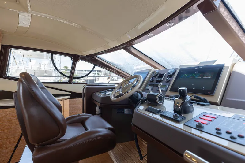 Slide: The Image of Luxurious helm of 2014 Azimut 60 Flybridge yacht with modern navigation controls. - 34