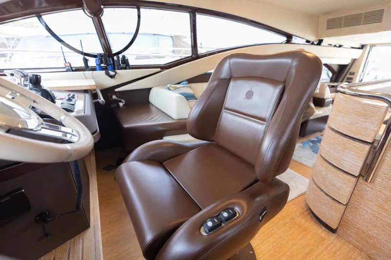 Slide: The Image of Luxurious interior of 2014 Azimut 60 Flybridge yacht with leather seating and modern controls. - 35