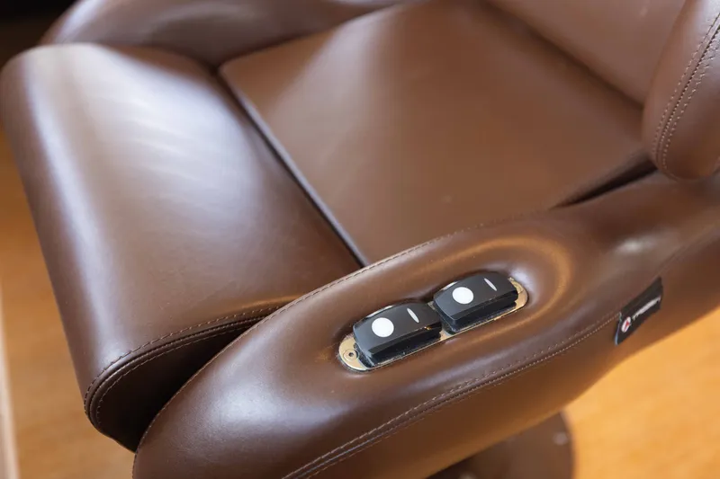 Slide: The Image of Brown leather seat with control buttons on Azimut 60 Flybridge, 2014 model. - 37
