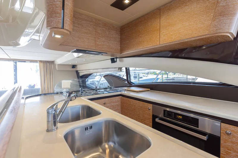 Slide: The Image of Luxurious kitchen interior of 2014 Azimut 60 Flybridge yacht with modern appliances. - 38
