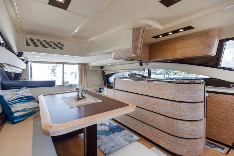 Slide: The Image of Luxurious interior of 2014 Azimut 60 Flybridge yacht with elegant wood finishes and modern design. - 39