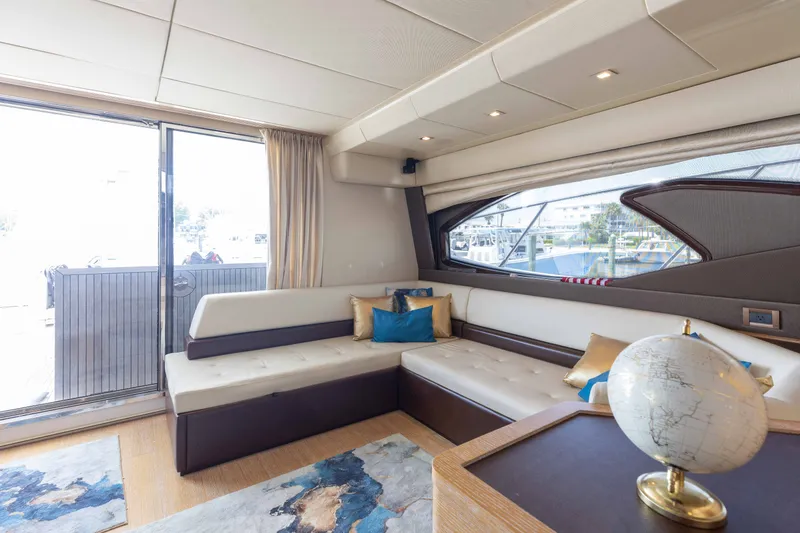 Slide: The Image of Luxurious interior of 2014 Azimut 60 Flybridge yacht with elegant seating and globe decor. - 40