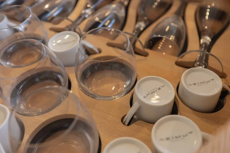 Slide: The Image of Wine glasses and Azimut-branded cups on a wooden rack, Azimut 60 Flybridge 2014. - 45