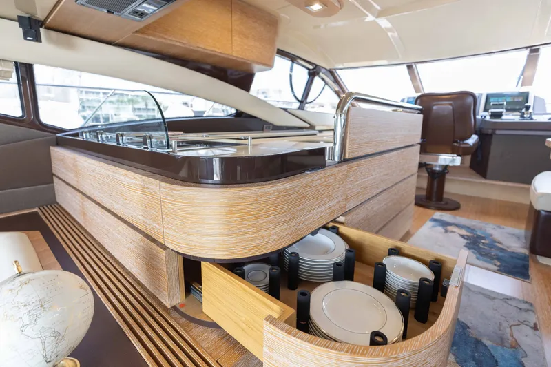Slide: The Image of Luxurious interior of a 2014 Azimut 60 Flybridge yacht with modern kitchen and dining area. - 47