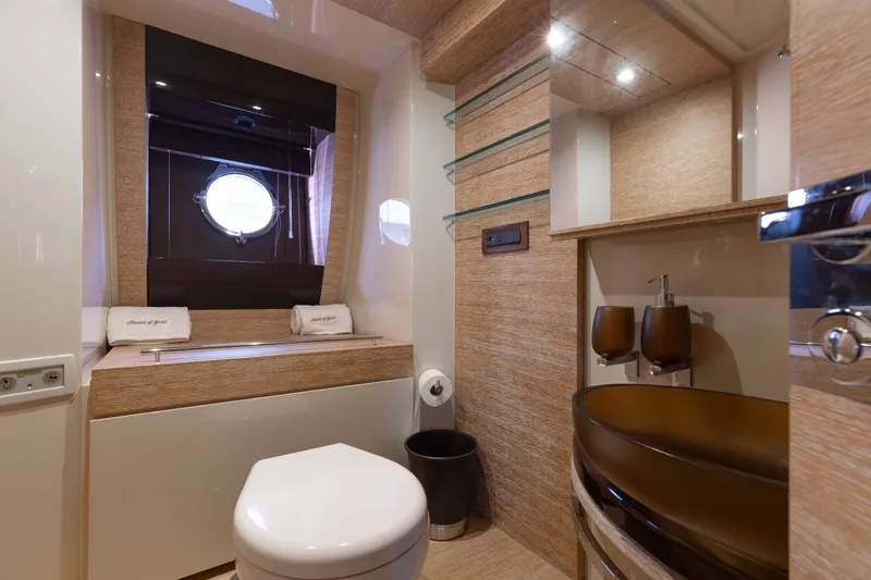 Slide: The Image of Luxurious bathroom on 2014 Azimut 60 Flybridge yacht with modern fixtures and porthole window. - 8