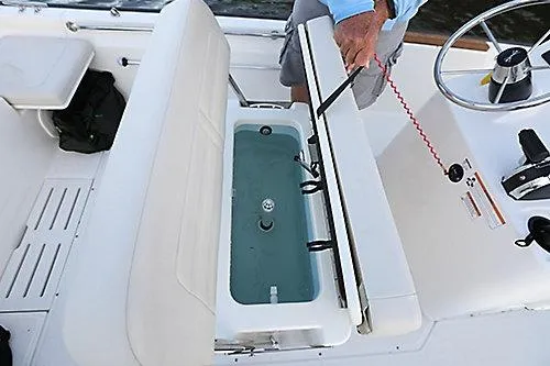 Slide: The Image of 2026 Boston Whaler 170 Montauk boat interior with open storage compartment. - 3