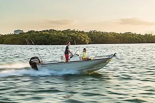 Slide: The Image of 2026 Boston Whaler 170 Montauk cruising on a serene lake at sunset. - 9