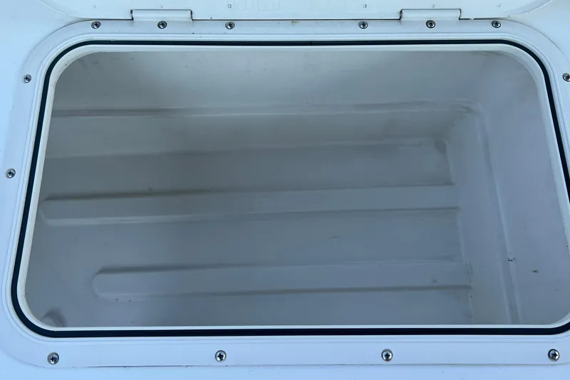 Slide: The Image of Storage compartment on a 2016 Back Cove 37 boat, open and empty. - 12
