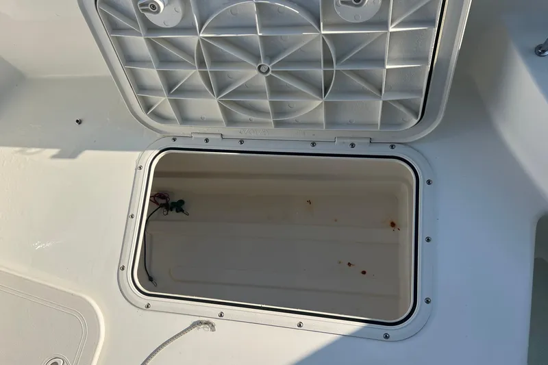 Slide: The Image of Open storage compartment on a 2016 Back Cove 37 boat, showing interior details. - 13
