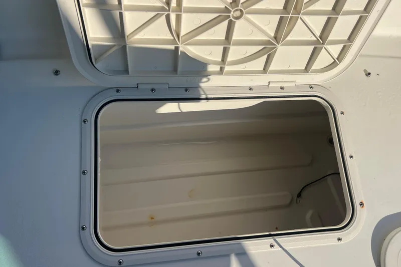 Slide: The Image of Open storage compartment on a 2016 Back Cove 37 boat, showcasing interior space. - 14