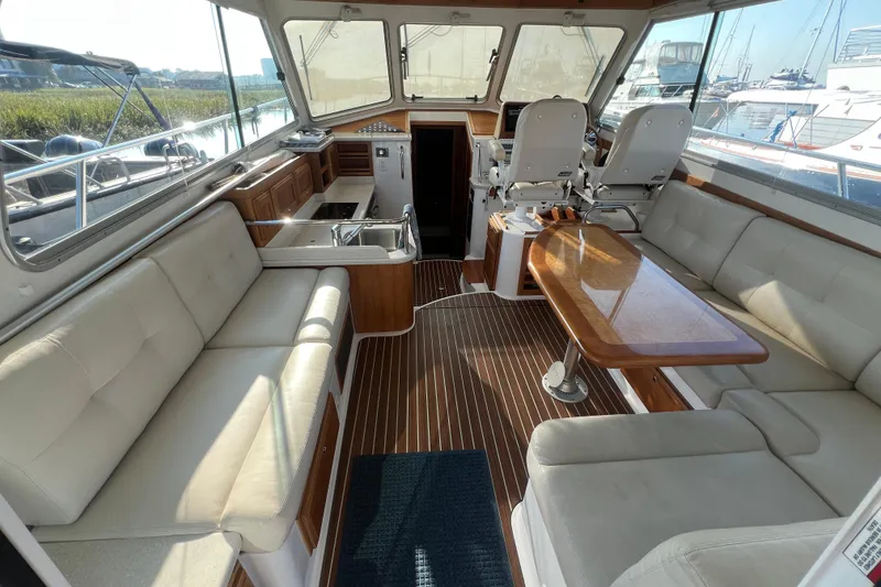 Slide: The Image of Luxurious interior of 2016 Back Cove 37 yacht with plush seating and elegant wood finishes. - 16