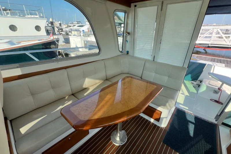 Slide: The Image of Luxurious seating area on a 2016 Back Cove 37 yacht with elegant wood table. - 17