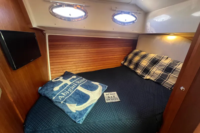 Slide: The Image of Interior of 2016 Back Cove 37 boat with helm station and seating. - 25