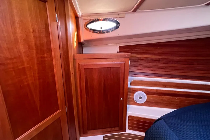 Slide: The Image of Luxurious cabin interior of 2016 Back Cove 37 yacht with cozy bed and wooden accents. - 28
