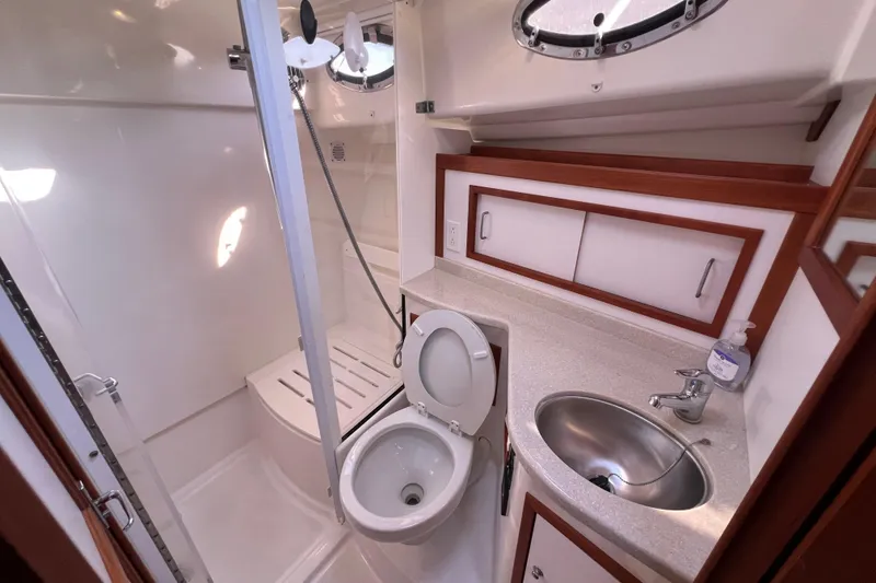 Slide: The Image of Cozy cabin interior of 2016 Back Cove 37 yacht with bed and wooden storage. - 29