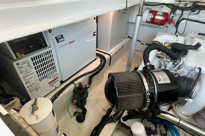 Slide: The Image of 2016 Back Cove 37 yacht bathroom with shower, toilet, sink, and storage cabinets. - 33