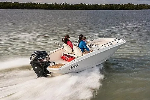 Slide: The Image of 2026 Boston Whaler 160 Super Sport boat speeding on water with passengers. - 2