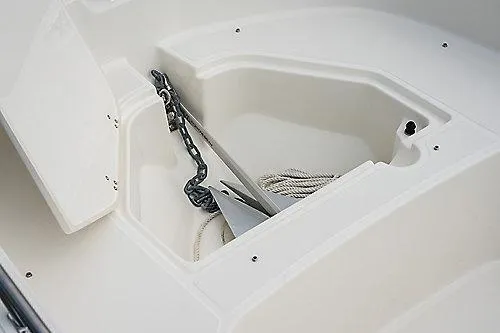 Slide: The Image of 2026 Boston Whaler 160 Super Sport anchor storage compartment with chain and rope. - 3