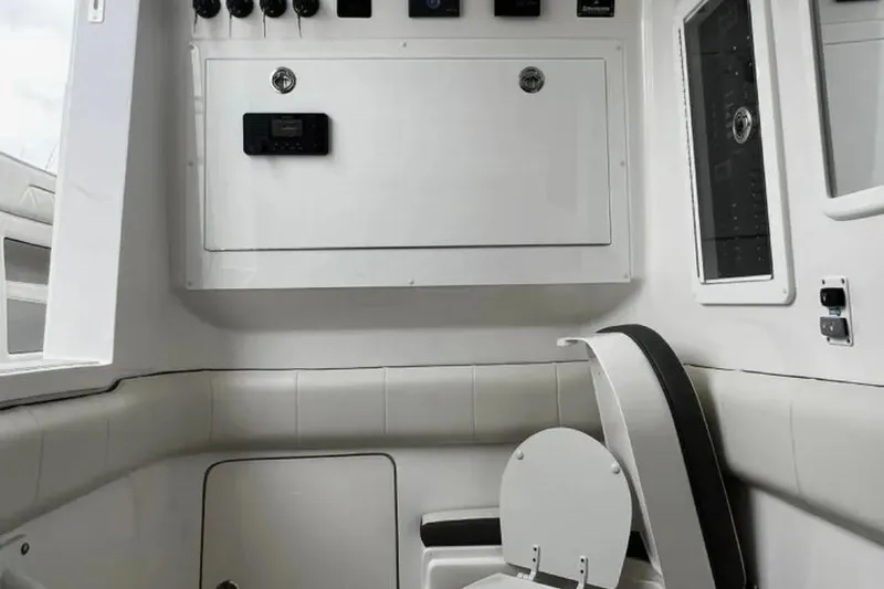 Slide: The Image of Interior of 2024 Deep Impact 399 Sport boat, featuring control panel and seating. - 15