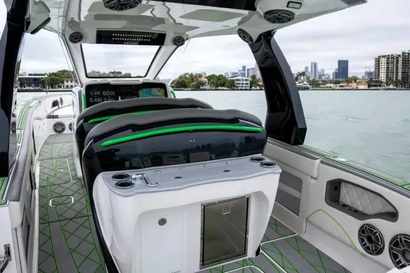 Slide: The Image of 2024 Deep Impact 399 Sport boat interior with modern design and waterfront cityscape. - 5